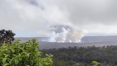 Cinematic-wide-panning-shot-of-volcanic-gasses-rising-from-Kilauea-Crater-as-seen-from-Volcano-House-on-the-first-day-of-eruption-in-September-2023-on-the-Big-Island-of-Hawai'i