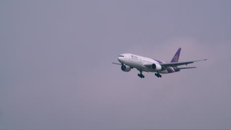 Thai-Airways-the-flag-carrier-of-Thailand-is-making-its-way-to-land-at-Don-Muang-Airport-tarmac-in-Bangkok,-Thailand