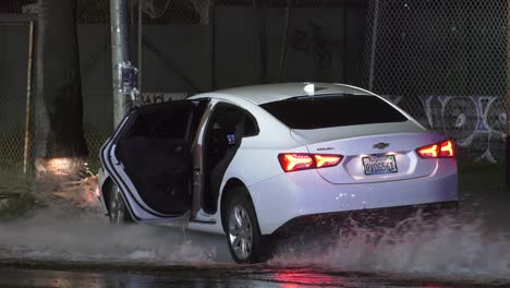 car-stuck-under-gushing-water