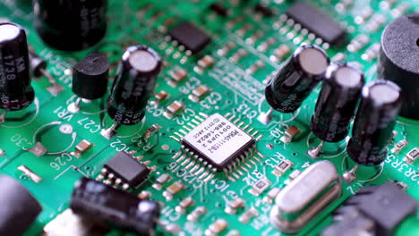 Zooming-out-from-a-close-up-of-a-circuit-board-and-showing-the-different-parts,-slots,-and-ports-in-its-main-frame