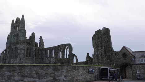 Slow-panning-shot-of-tourists-buying-tickets-to-enter-and-explore-Whitby-Abbey