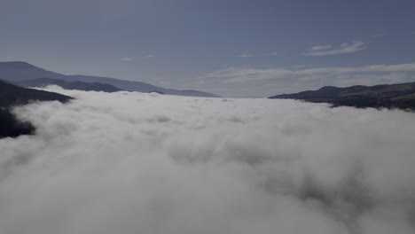 Elevated-Tranquility:-Aerial-Gaze-Above-the-Clouds-and-Forested-Mountains