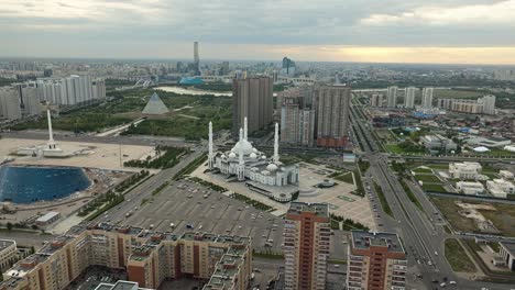 Hazrat-Sultan-Mosque,-Pyramid-Of-Peace-And-Accord,-And-Monument-Kazakh-Eli-At-Dusk-In-Astana,-Kazakhstan