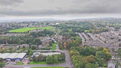 Drone-rises-above-suburban-neighborhood-in-Huddersfield-England-on-cloudy-day