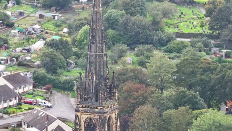 Drone-descends-along-old-historic-weathered-church-in-Huddersfield