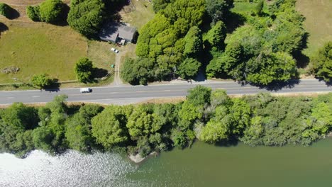 Aerial-video-capturing-a-road-surrounded-by-greenery-in-Bodega-Bay,-California