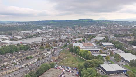 Panoramic-aerial-establishing-view-of-Huddersfield-on-cloudy-day