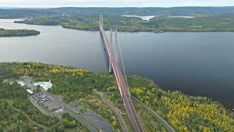 Scenic-Vista-Of-Hogakustenbron-Suspension-Bridge-in-Sweden-With-Calm-And-Autumn-Forest