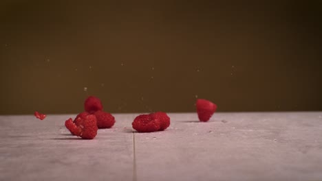 Raspberries-falling-on-surface-and-water-splashes-everywhere-in-super-slow-motion-1000fps-4k-Impact