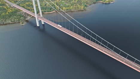 Above-View-Of-A-White-Trailer-Truck-Crossing-Hogakustenbron-Bridge-In-Sweden