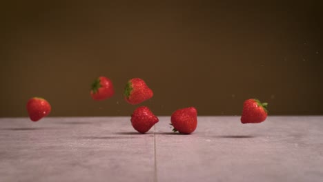 Strawberries-falling-on-surface-and-water-splashes-everywhere-in-super-slow-motion-1000fps-4k-Impact