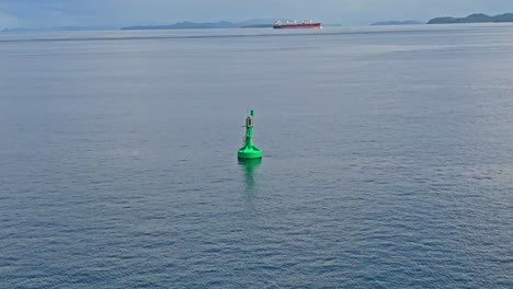 Aerial-point-of-interest-of-marine-navigation-buoy-in-the-Surigao-Strait,-Philippines