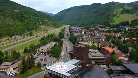Aerial-view-low-over-the-hospital-and-streets-of-the-Vail-town,-summer-in-Colorado,-USA
