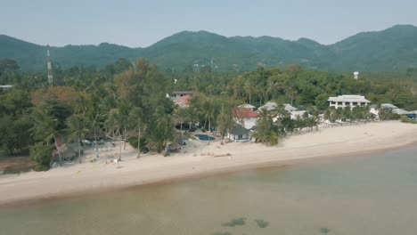 Incredible-drone-footage-of-the-beach,-resort-and-mountains-in-Koh-Phangan-Thailand