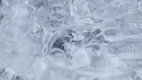 Static-macro-shot-of-water-pulsing-behind-ice