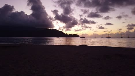 Gimbal-slow-panning-shot-of-the-picturesque-beach-at-Hanalei-Bay-during-sunset-on-the-Hawaiian-island-of-Kaua'i