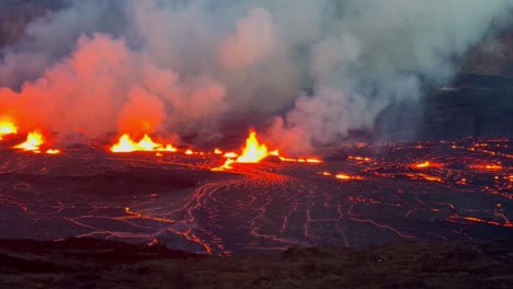 Cinematic-long-lens-panning-shot-across-the-illuminated-lava-lake-at-Kilauea-at-sunset-on-the-first-evening-of-eruption-in-September-2023-at-Hawai'i-Volcanoes-National-Park