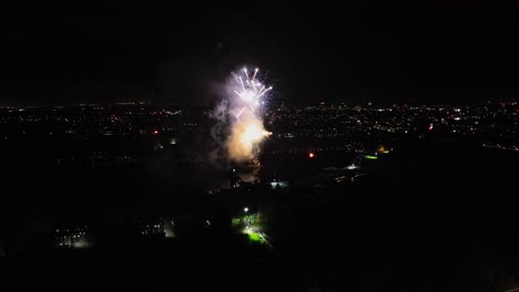 Aerial-shot-of-small-vibrant-fireworks-being-set-off-on-bonfire-night-in-the-UK