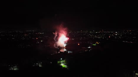 Aerial-shot-of-small-fireworks-being-set-off-at-an-event-on-bonfire-night