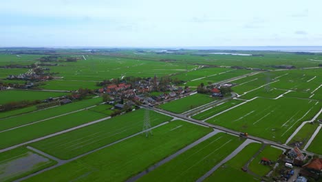 Approaching-traditional-Dutch-village-Zunderdorp-in-Polder-by-drone