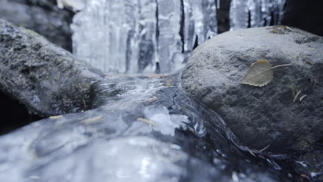 Wide-shot-of-a-small-frozen-waterfall
