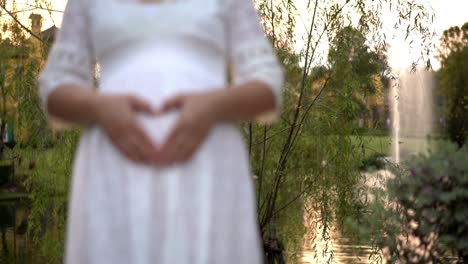 Pregnant-woman-feeling-happy-at-garden-home.