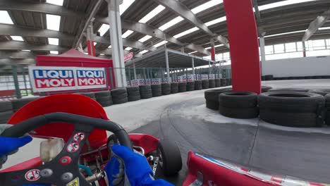 First-person-pilot-point-of-view-of-Go-Kart-race-on-indoor-and-outdoor-track
