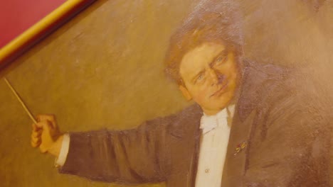 Handheld-pov-shot-of-painting-of-Dutch-conductor-holding-a-baton