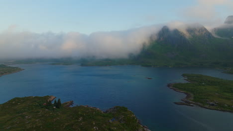 Stunning-cloud-and-fog-covered-mountains-along-Lofoten-Norway-coast-in-summer