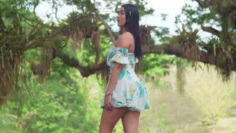 Sexy-latina-in-a-tropical-park-in-a-short-dress-on-a-sunny-day