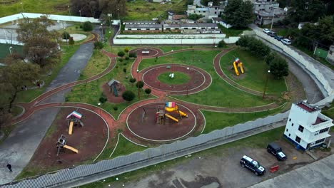 Bird's-eye-view-of-a-playground-with-wrap-around-design-and-friendly-walkways-in-a-small-village
