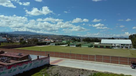 Aerial-orbit-over-a-lonely-soccer-field-in-Almoloya,-a-sunny-day-in-the-state-of-Mexico