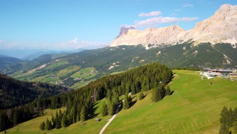 Aerial-panoramic-over-ski-field-and-mountain-vista-to-valley