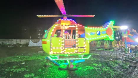 Little-kids-are-enjoying-the-kids-helicopter-ride-at-night