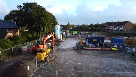 Construction-and-building-site-in-England-with-digger-and-scaffolding