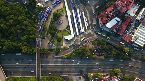 Aerial-timelapse-of-the-Chapultepec-Metro-station-and-the-Belen-Fountain-with-parked-buses-and-high-vehicular-traffic-in-CDMX