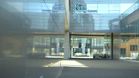 Glass-building-facade-with-reflections-and-open-space