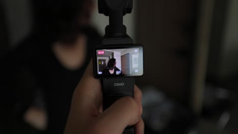 Face-Track-Mode-Being-Used-On-LCD-Screen-On-DJI-Osmo-Pocket-3-Following-Female-Around-Room