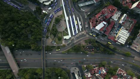 Aerial-view-establishing-of-the-Chapultepec-subway-station-in-Mexico-City,-central-station-with-a-lot-of-car-movement