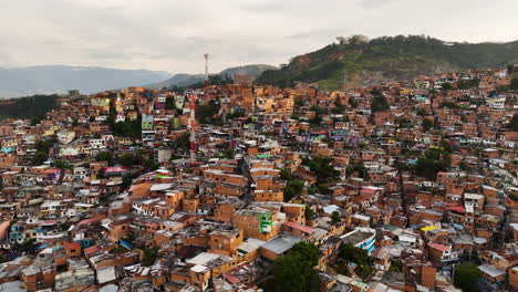 Aerial-overview-of-vibrant-poverty-homes-in-San-Javier,-Medellín,-comuna-trece,-Colombia