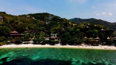 Panning-from-top-to-bottom-and-pulling-in-slowly-towards-the-beachfront-of-Sai-Daeng-a-private-beach-resort-in-Koh-Tao-island-in-Surat-Thani-province-in-Thailand