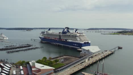Luxury-Cruise-Ship-Docked-In-Maine,-Tracking-Aerial-Shot