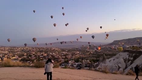 Walking-to-the-moon-or-visit-the-Cappadocia-historical-city-of-turkey-rock-house-building-erosion-geotourism-geology-hot-air-balloon-in-twilight-early-morning-sunrise-summer-season-landmark-attraction