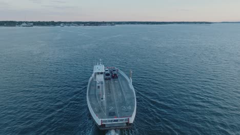 Top-Down-Aerial-Drone-shot-of-Ferry-departing-Shelter-Island-heading-towards-Greenport-North-Fork-Long-Island-New-York-before-sunrise