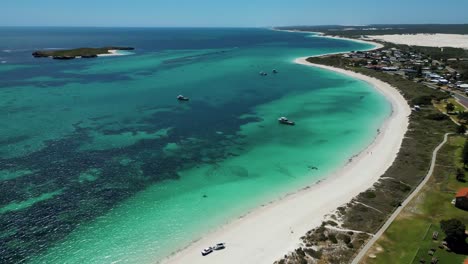 Aerial-view-of-four-wheel-driving-on-Lancelin-Beach-white-sand-landscape,-Western-Australia
