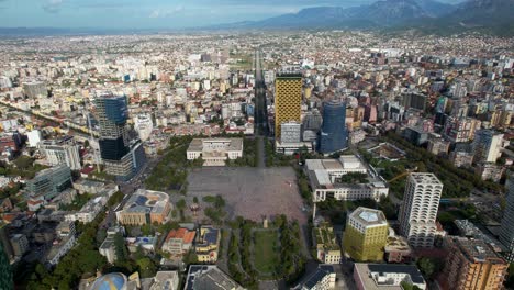 Central-Square-of-Tirana's-Capital,-Offering-a-Glimpse-into-the-City's-Vibrancy-with-Surrounding-Buildings-and-Streets