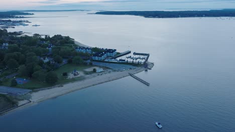 Aerial-Drone-shot-of-Orient-Greenport-North-Fork-Long-Island-New-York-before-sunrise-with-ferry-and-houses