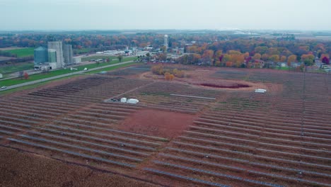 Solar-panels-in-autumn-fields-highlight-the-synergy-of-modern-energy-and-traditional-farming,-Atwater,-Minnesota,-USA