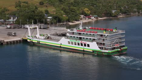 Aerial-pan-of-a-vehicle-and-passenger-ferry-boat-at-Lipata-Ferry-Port