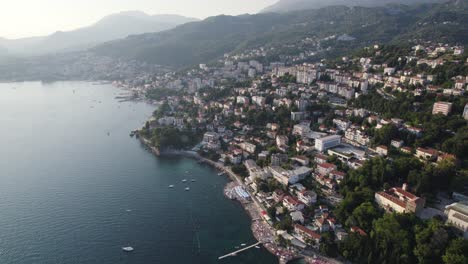 Beautiful-European-coast-city-Herceg-Novi,-Montenegro,-aerial-establisher-sunset
